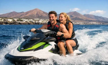 Couple enjoying jet ski ride in Lanzarote waters near Puerto del Carmen Atlantic Ocean summer watersports experience