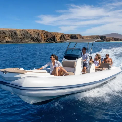 Private speedboat charter cruising along the volcanic coast of Lanzarote