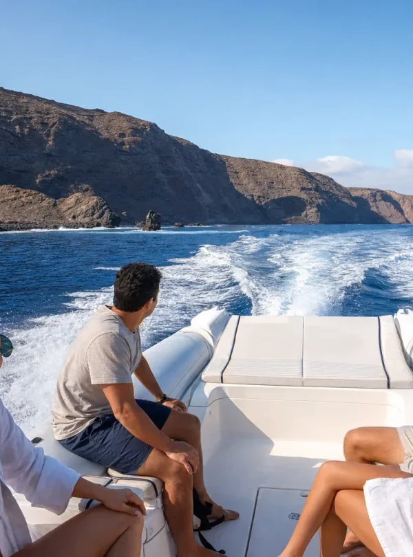Private speedboat cruising along the volcanic coast of Lanzarote