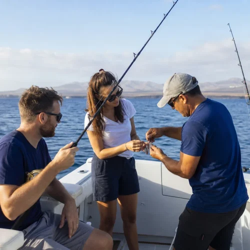 Guests preparing fishing gear with a professional crew on a boat in Lanzarote